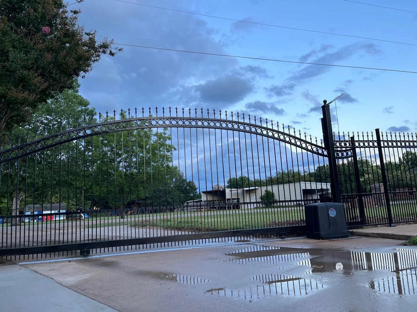 Ornamental metal entry gate with automatic operator